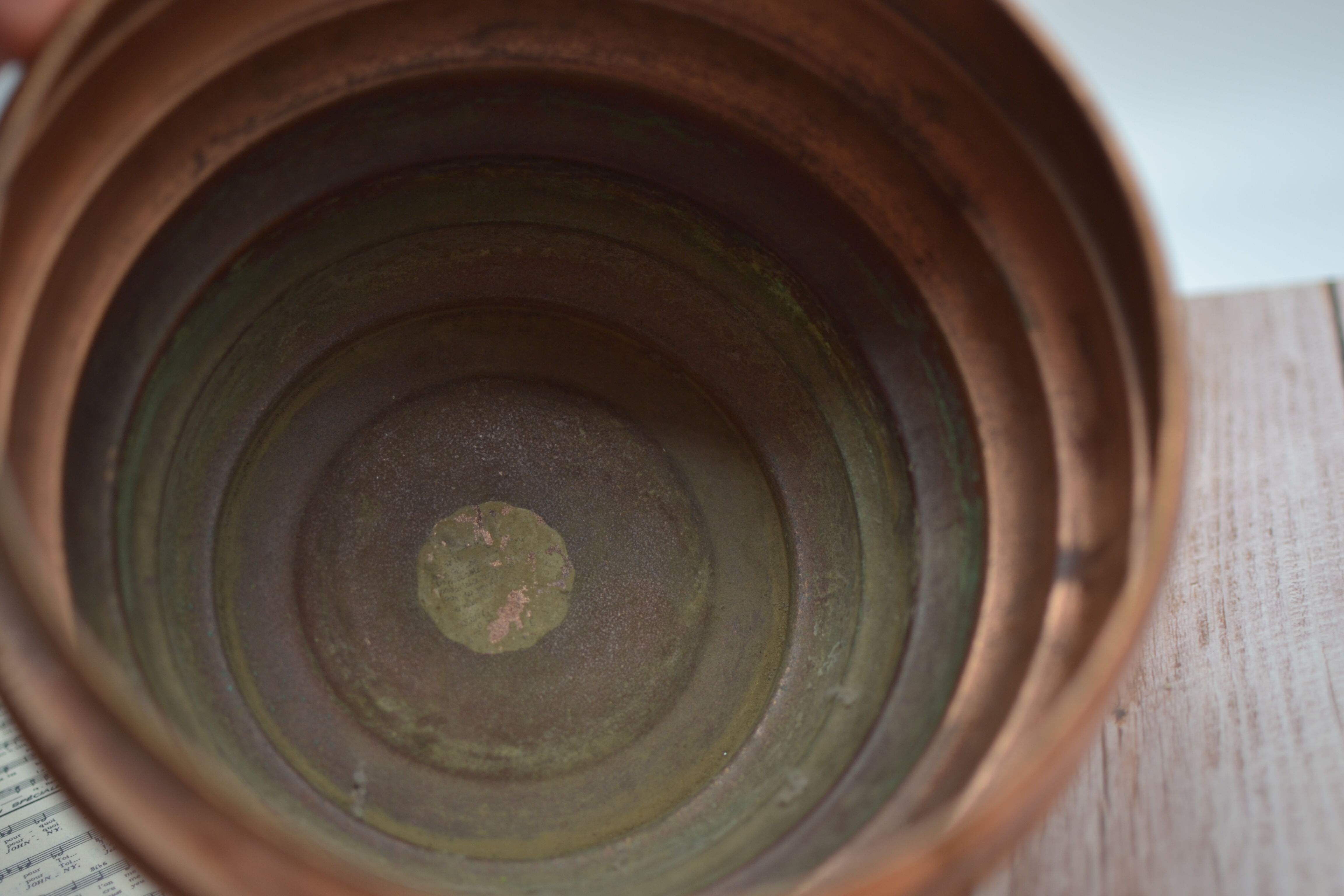 Old copper pot cover