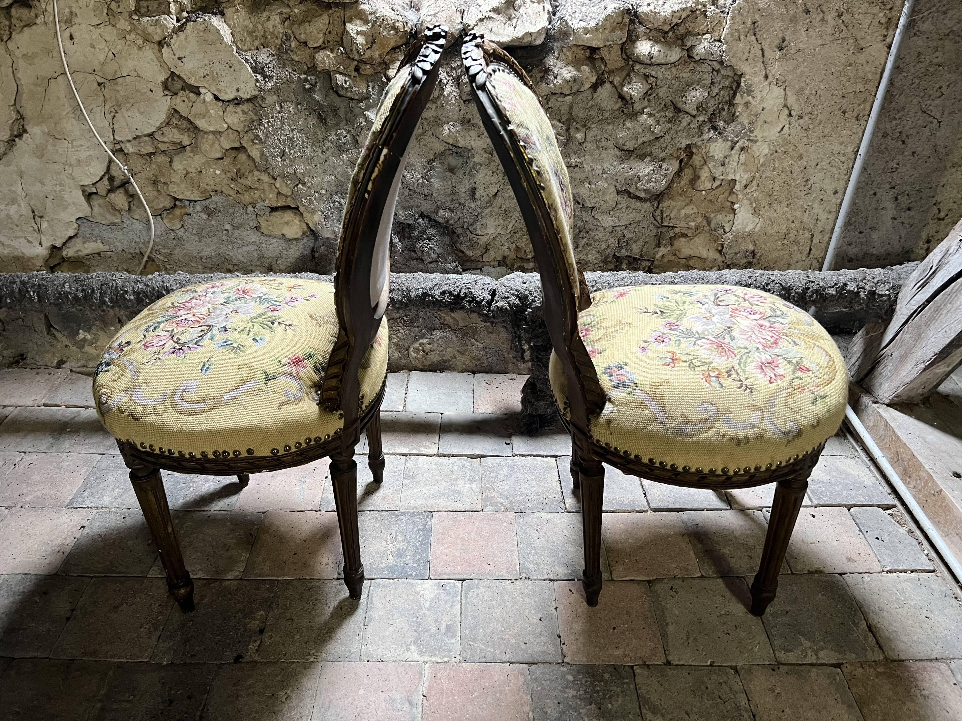 pretty pair of Louis XVI style chairs, in carved and gilded wood