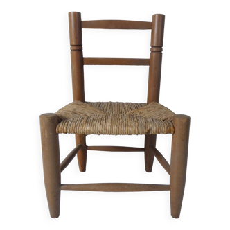 Old wooden straw chair for children