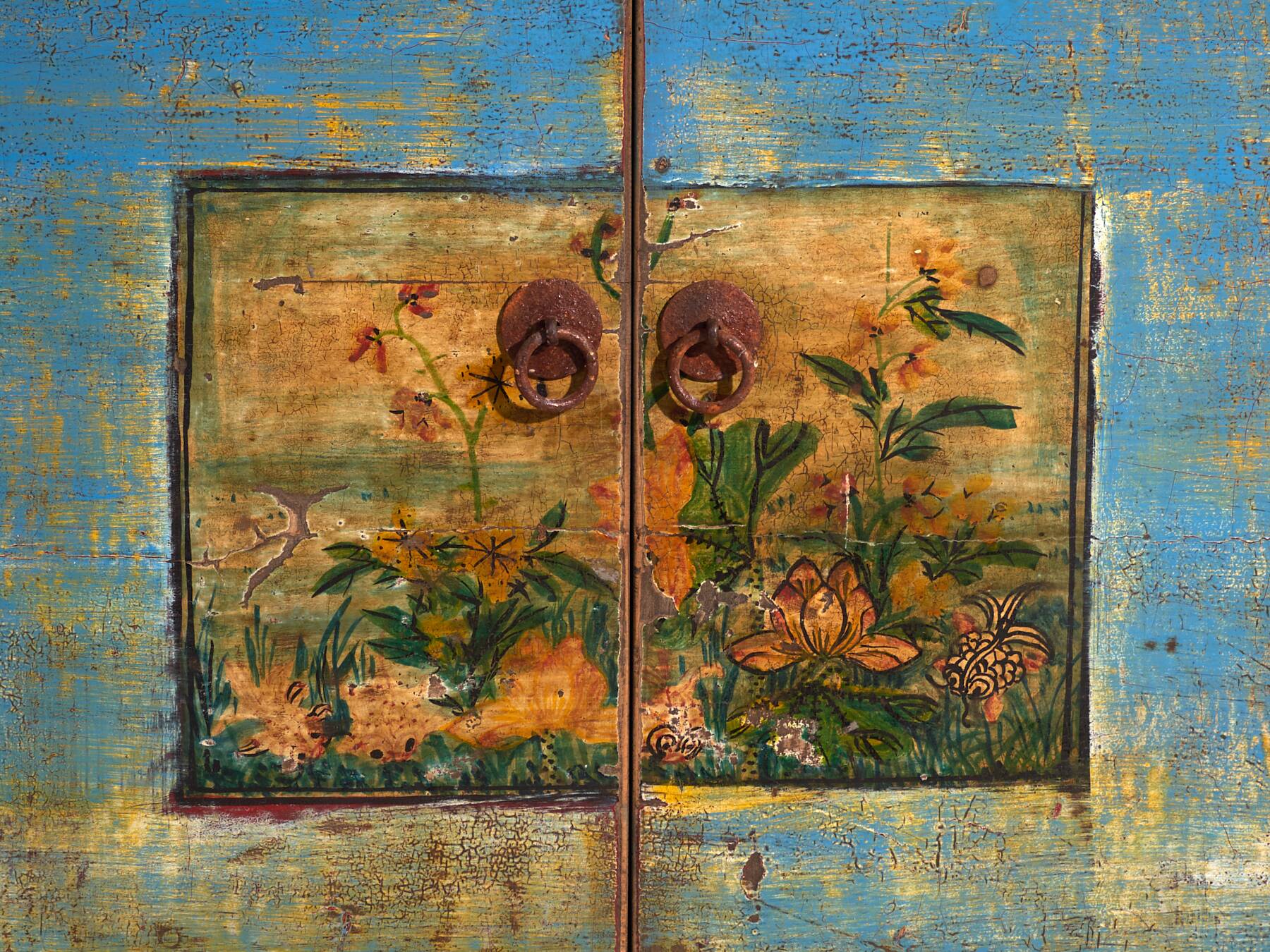 Old wooden entrance buffet in blue and yellow tones (circa 1920).