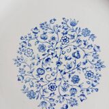 Round antique earthenware dish with floral decoration