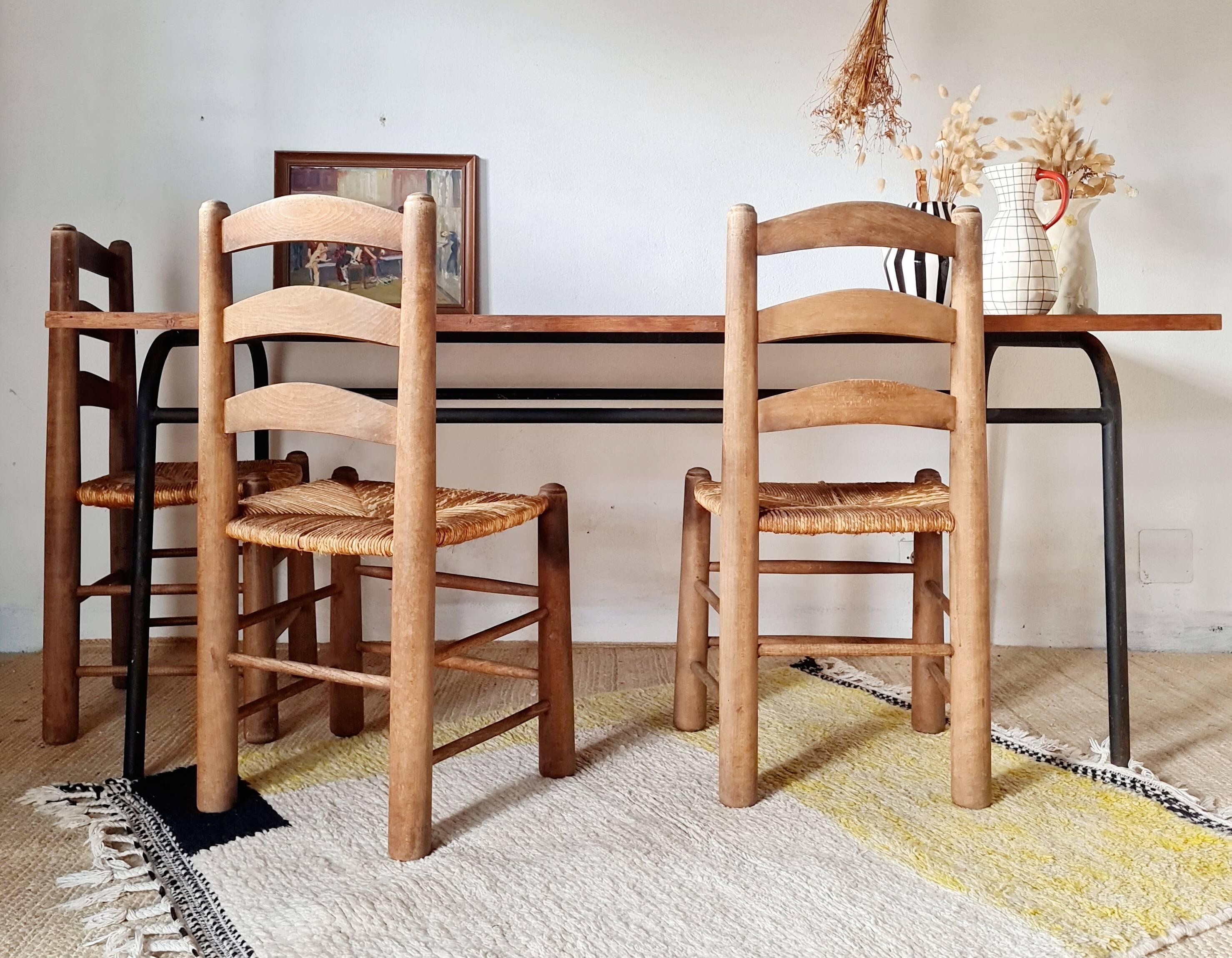 Table with tubular metal legs and wooden top.