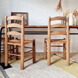 Table with tubular metal legs and wooden top.