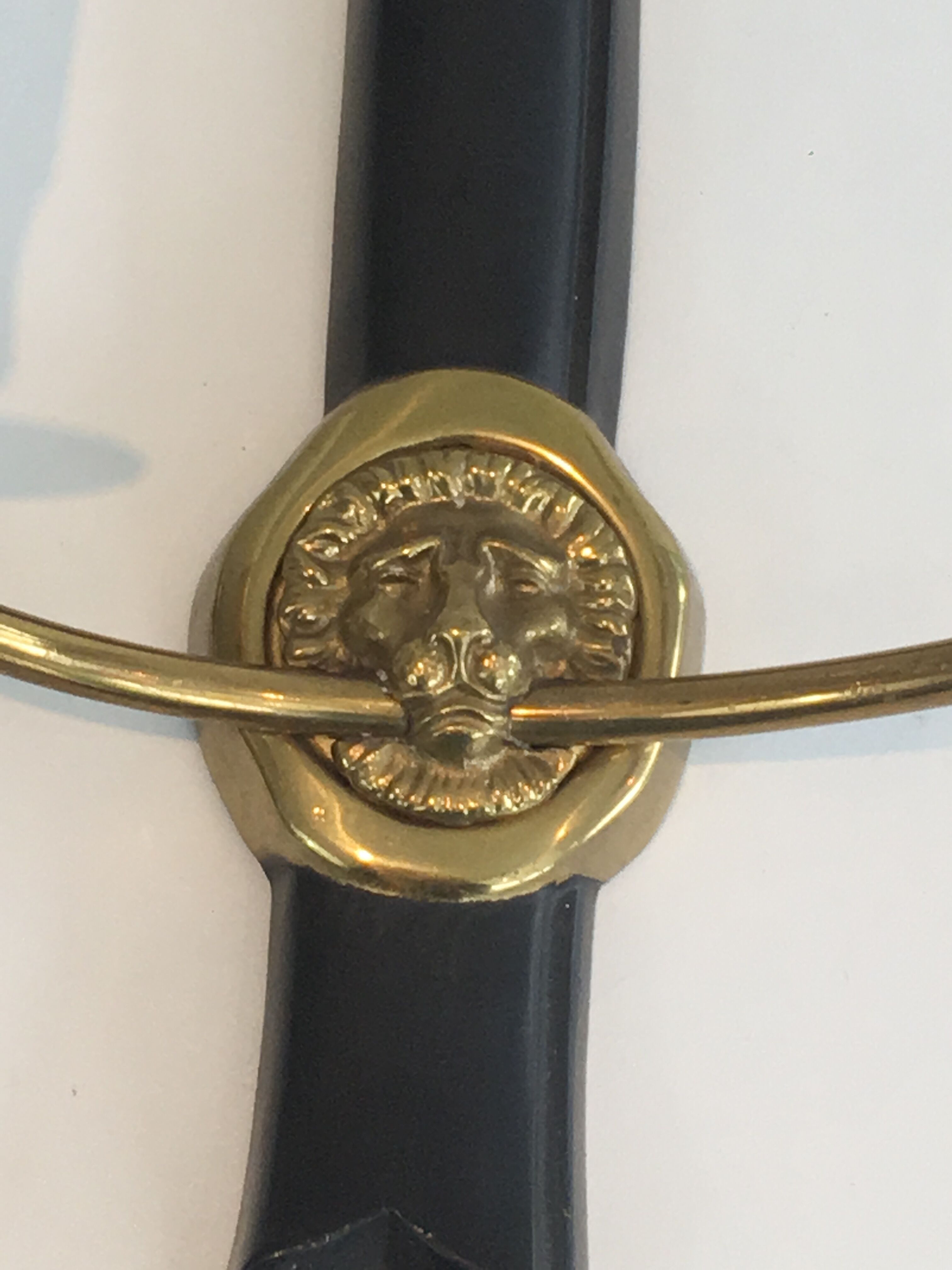 Pair of Black Lacquered Bronze Wall Lamps with Lions' Head Decorations. Around 1970