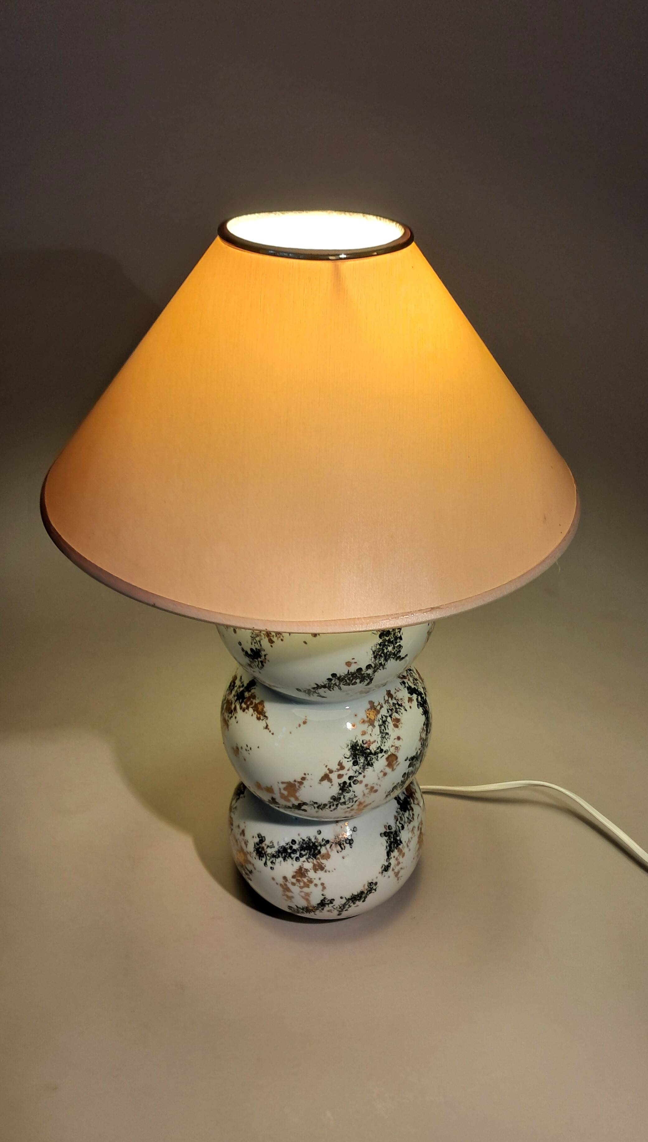 Fine porcelain lamp painted and gilded with fine gold. Laure Selignac, Paris.