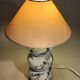 Fine porcelain lamp painted and gilded with fine gold. Laure Selignac, Paris.