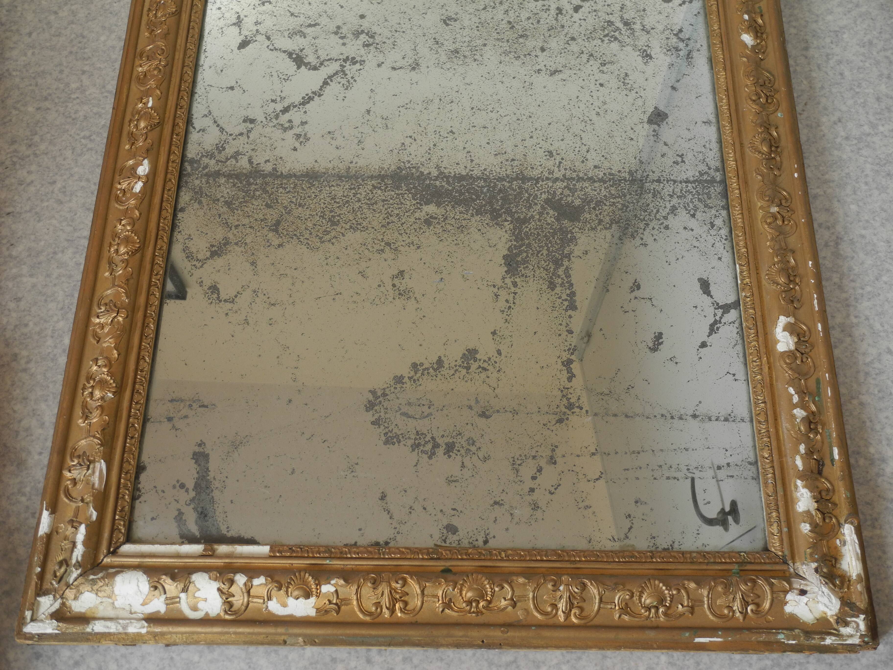 antique mercury mirror with gilded wood and stucco from the 19th century