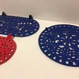 Set of four enameled cast iron trivets retro design vintage art