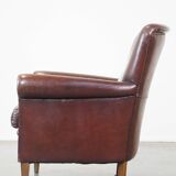 Sheepskin armchair correctly finished with decorative nails and in good condition