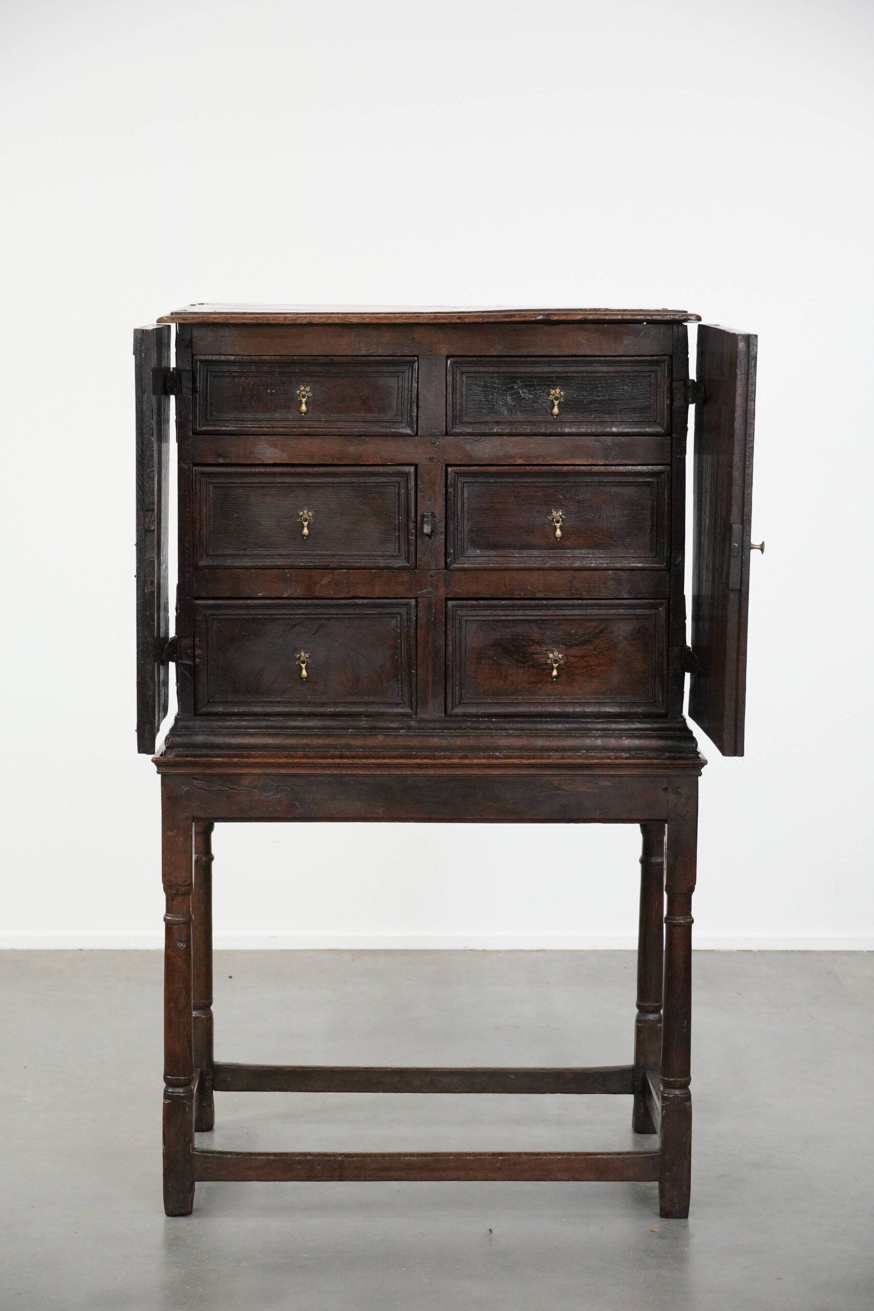 Unique antique English cabinet on stand made of oak from the 17th century