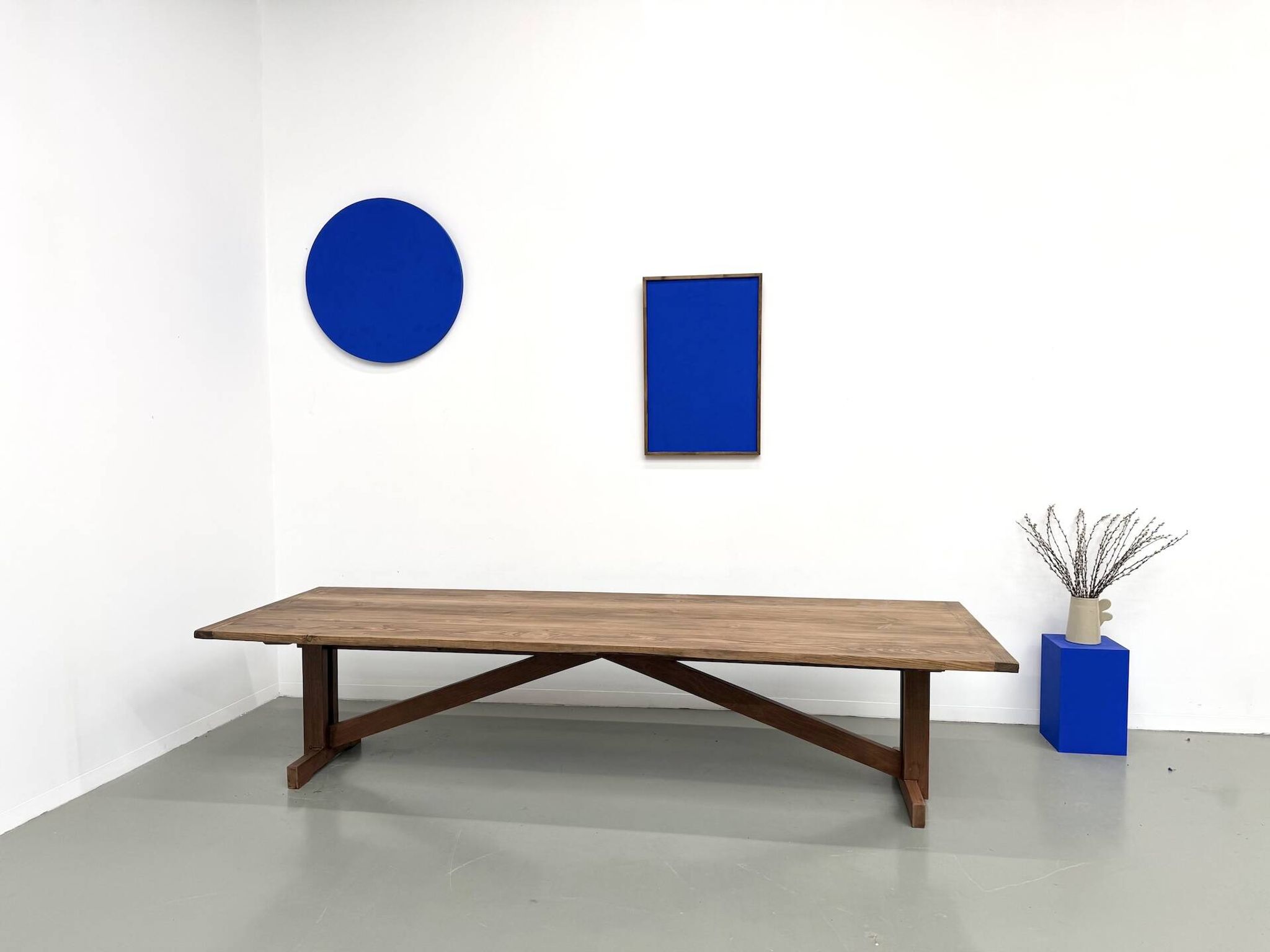 Refectory table in solid pine and beech, with X-shaped legs.