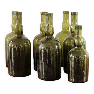 Set of 7 old glass bottles