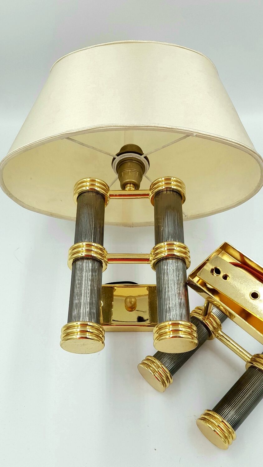 Pair of designer golden brass wall lights with gun barrel decor
