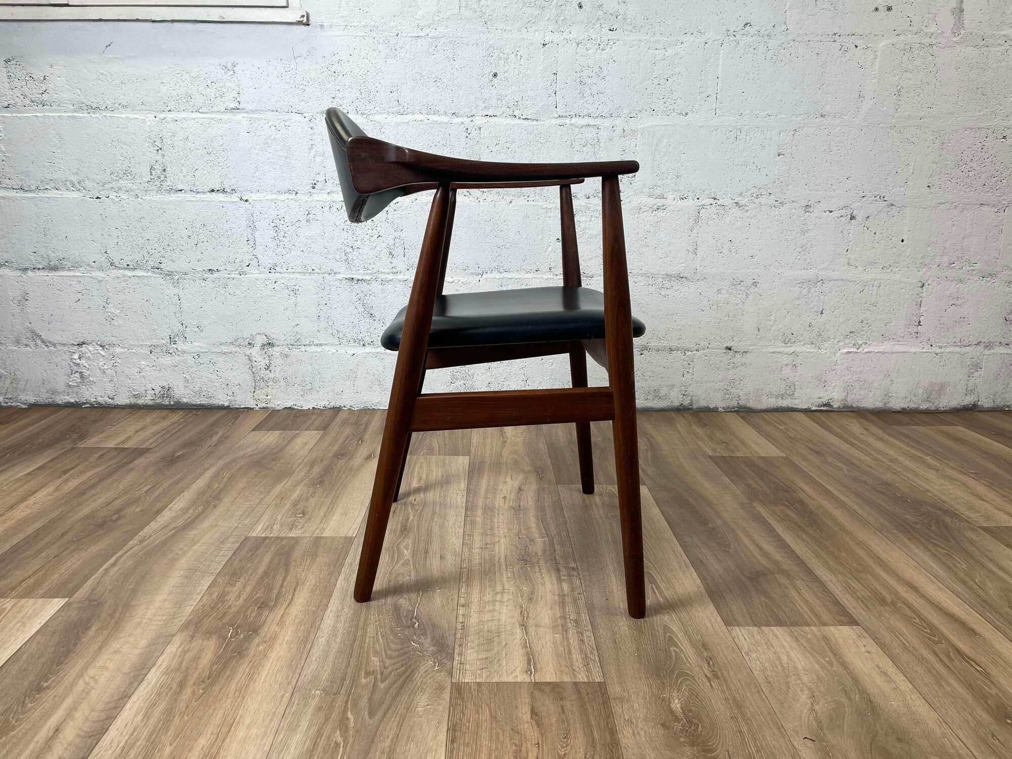 Vintage Scandinavian armchair in teak and black skai, 60s