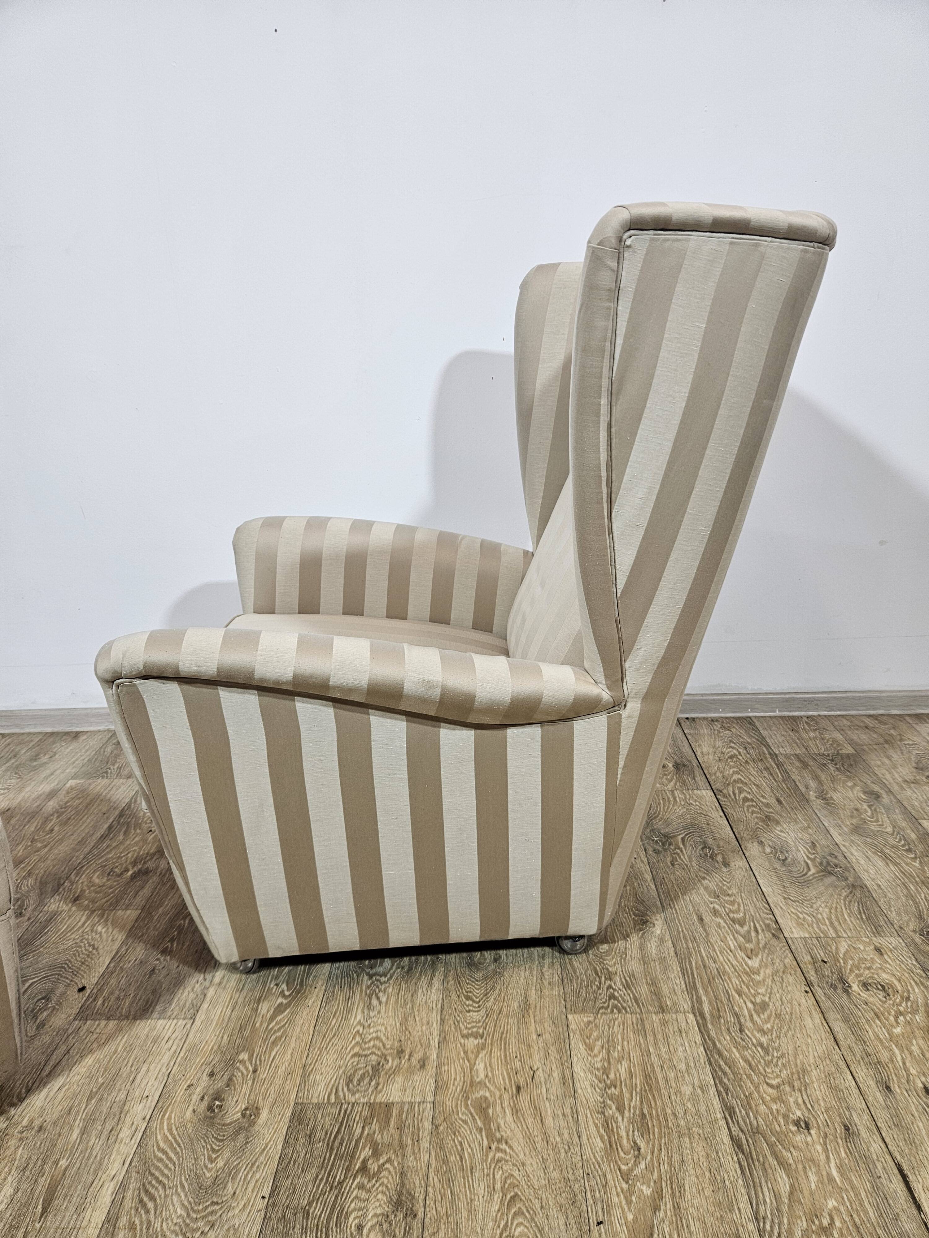 Winged armchair with footstool, 1960s.