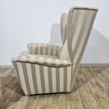 Winged armchair with footstool, 1960s.