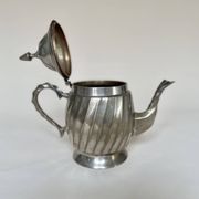 Silver-plated metal teapot with fluted body in Art Deco style