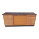 Workshop furniture with drawers and curtain in beech and walnut.