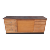 Workshop furniture with drawers and curtain in beech and walnut.