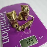 Set of three brass cats