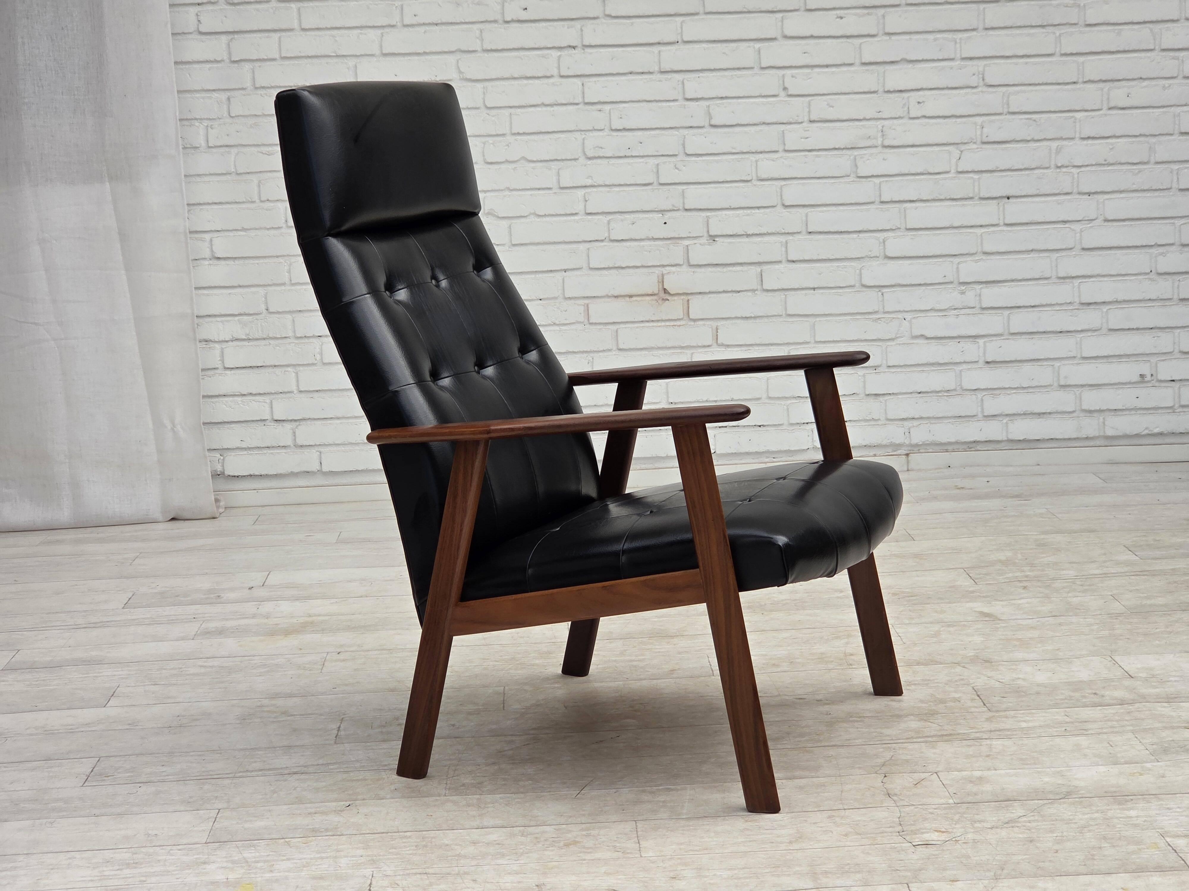 1970s, Danish armchair, black artificial leather, teak wood.