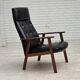 1970s, Danish armchair, black artificial leather, teak wood.