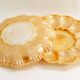 Pair of iridescent orange glass egg plates