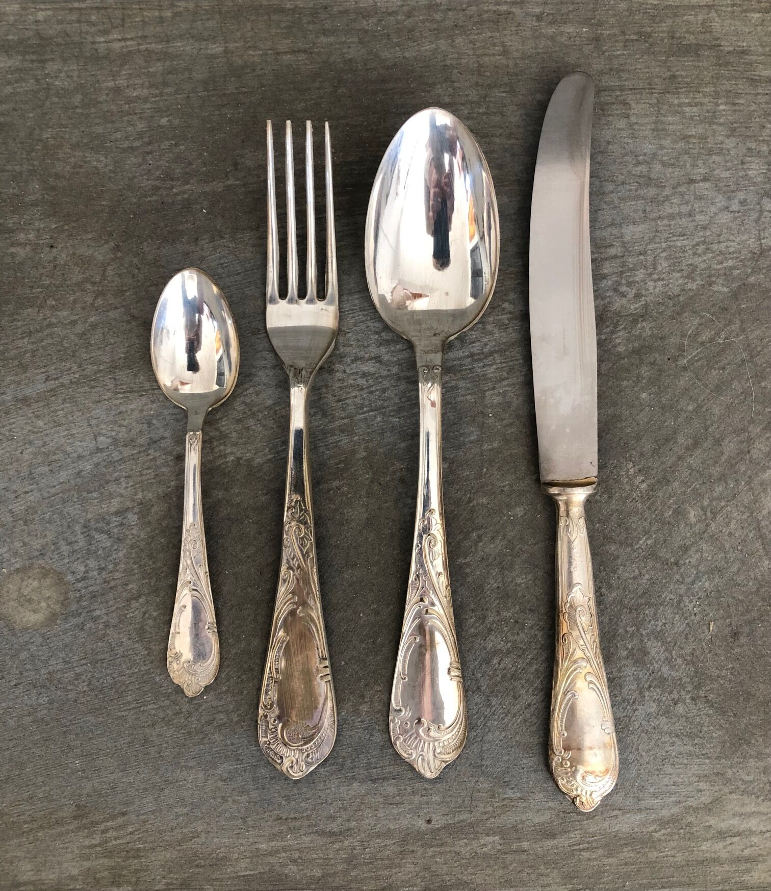 Series of 24 antique silver metal cutlery