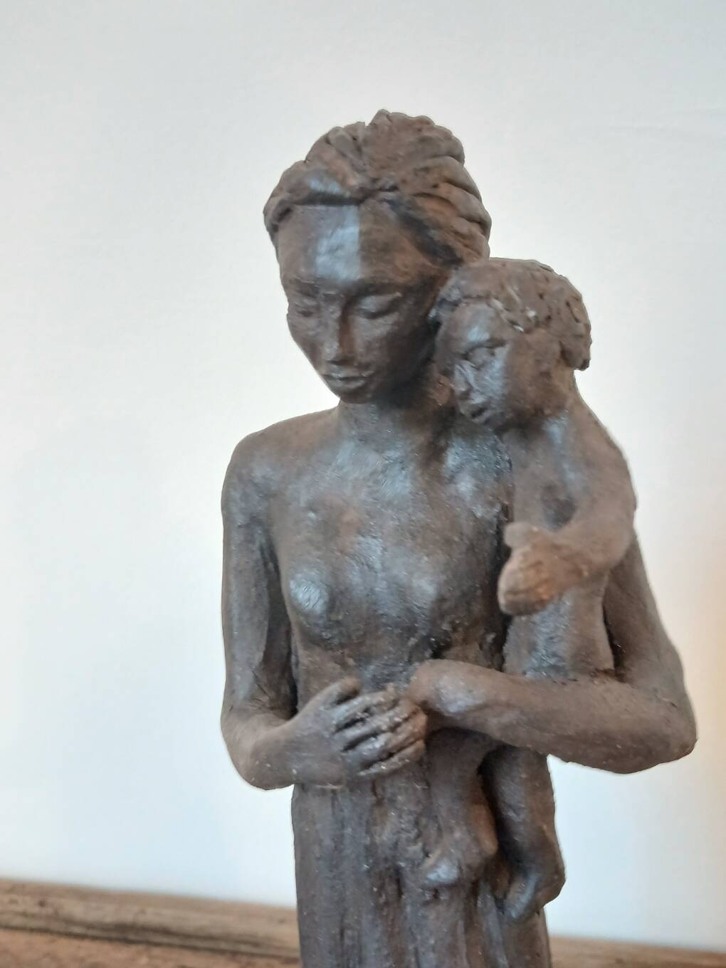 Sculpture representing a woman holding a child - original terracotta