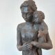 Sculpture representing a woman holding a child - original terracotta