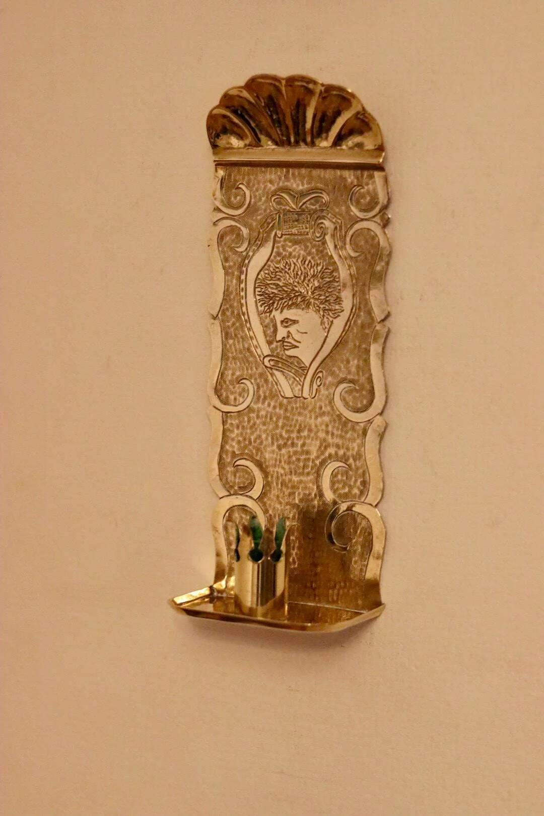 A pair of Swedish brass wall sconces from the mid-century.