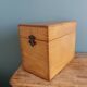 Wooden storage box, empty pocket