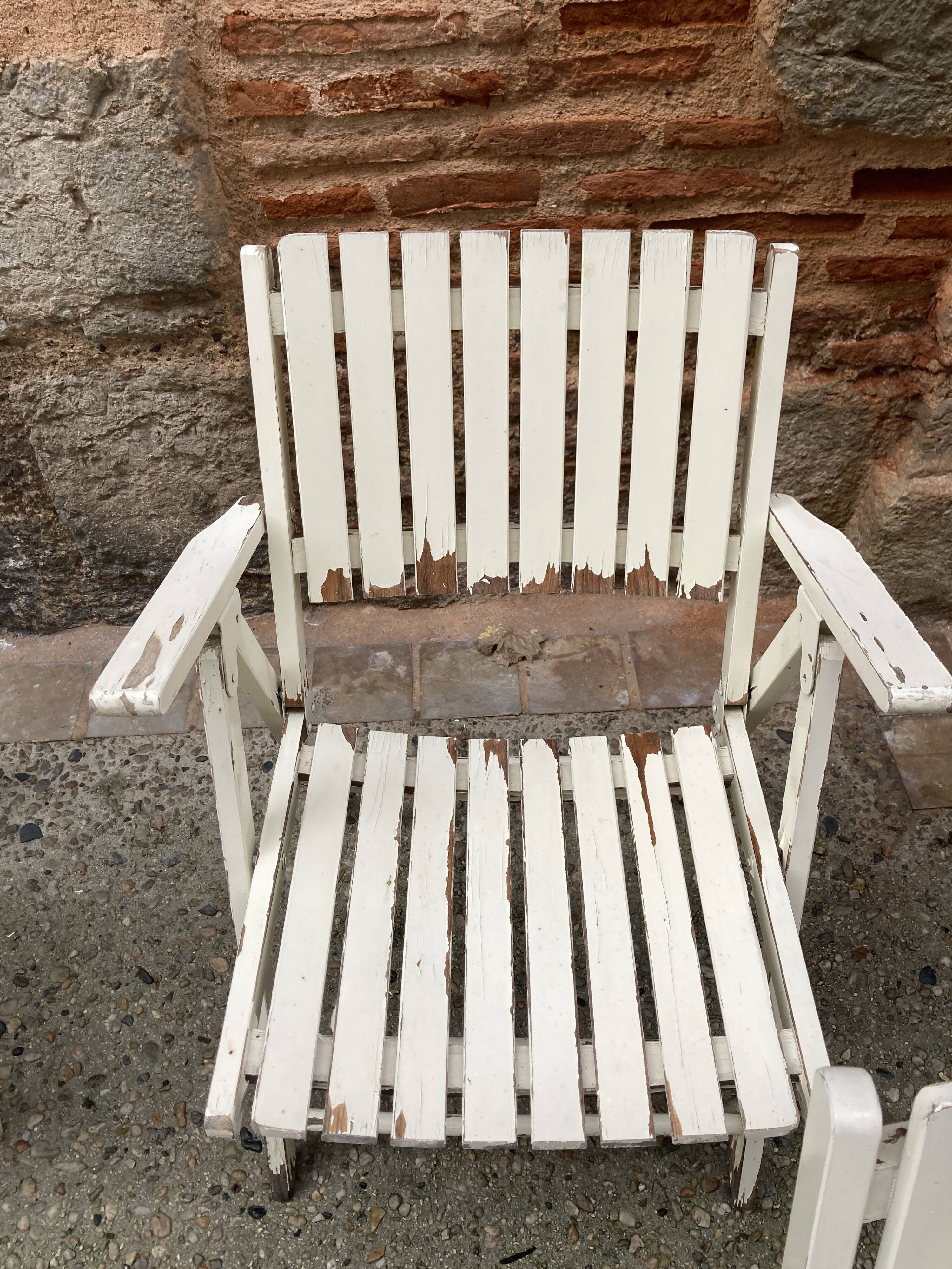 Five wooden garden armchairs
