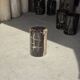 Small side table in black petrified wood with stripes and beige sides H28 D18.