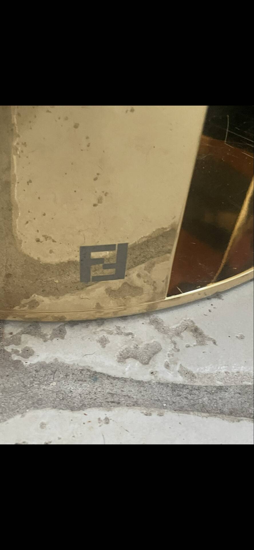2 bedside tables and a brass Fendi table.