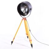 Old industrial spot on wooden tripod