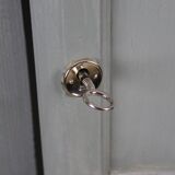 Renovated Parisian wardrobe – sage green with white patina