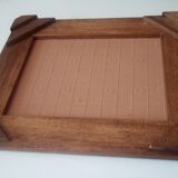 Underside of vintage wood and ceramic dish