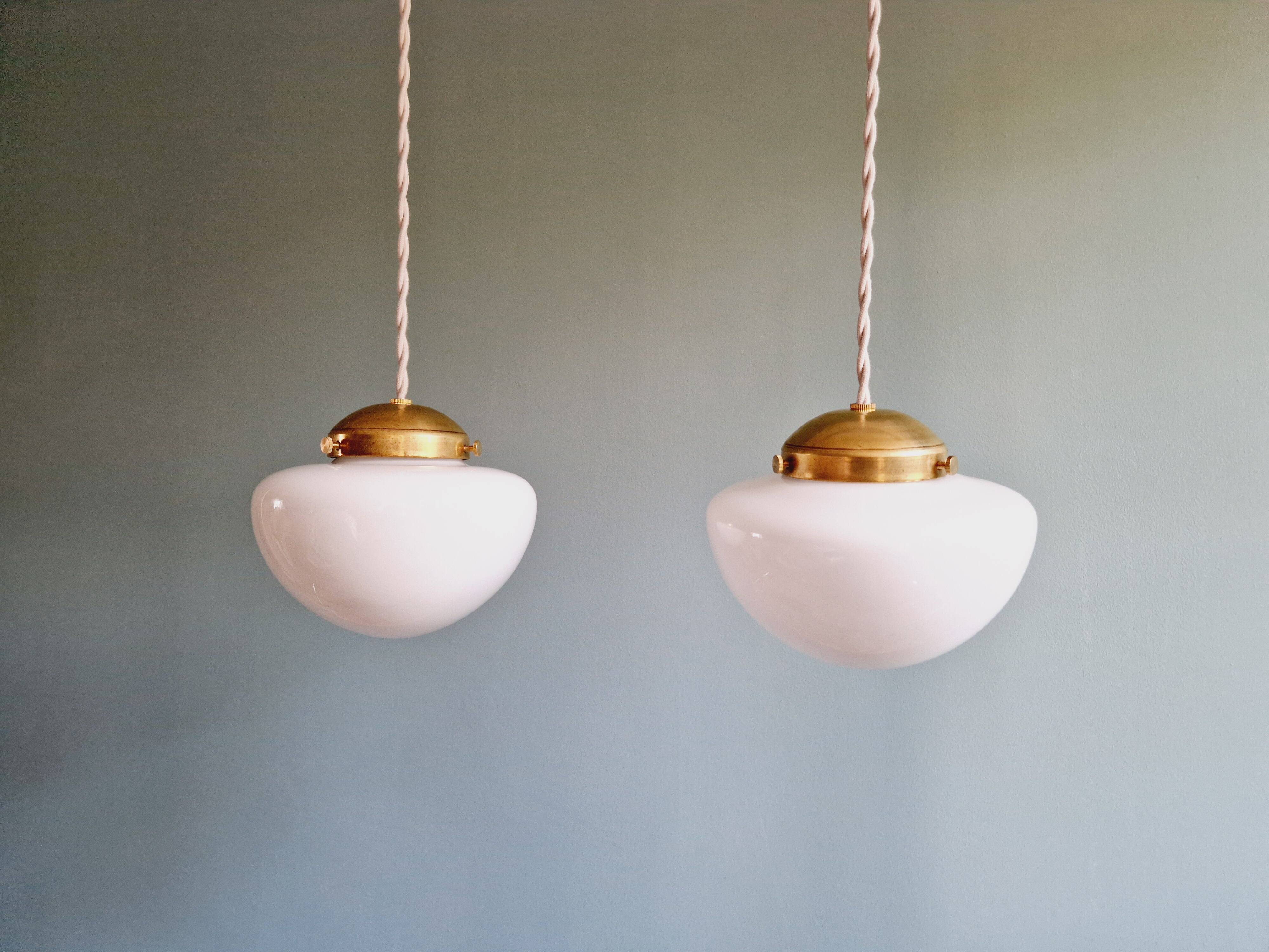 Duo of Art Deco suspensions in white opaline, 1920s-30s
