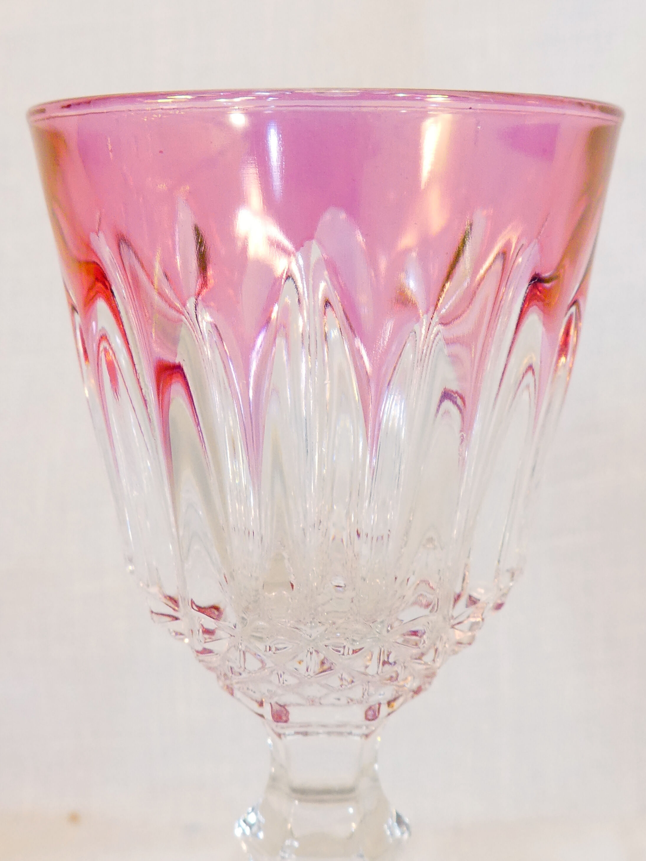 10 glasses with coloured liquor