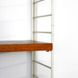 'string' bookcase with metal frame