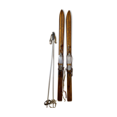 Pair of vintage wooden skis and sticks