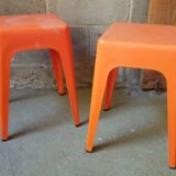 Pair of AMI stools in orange plastic