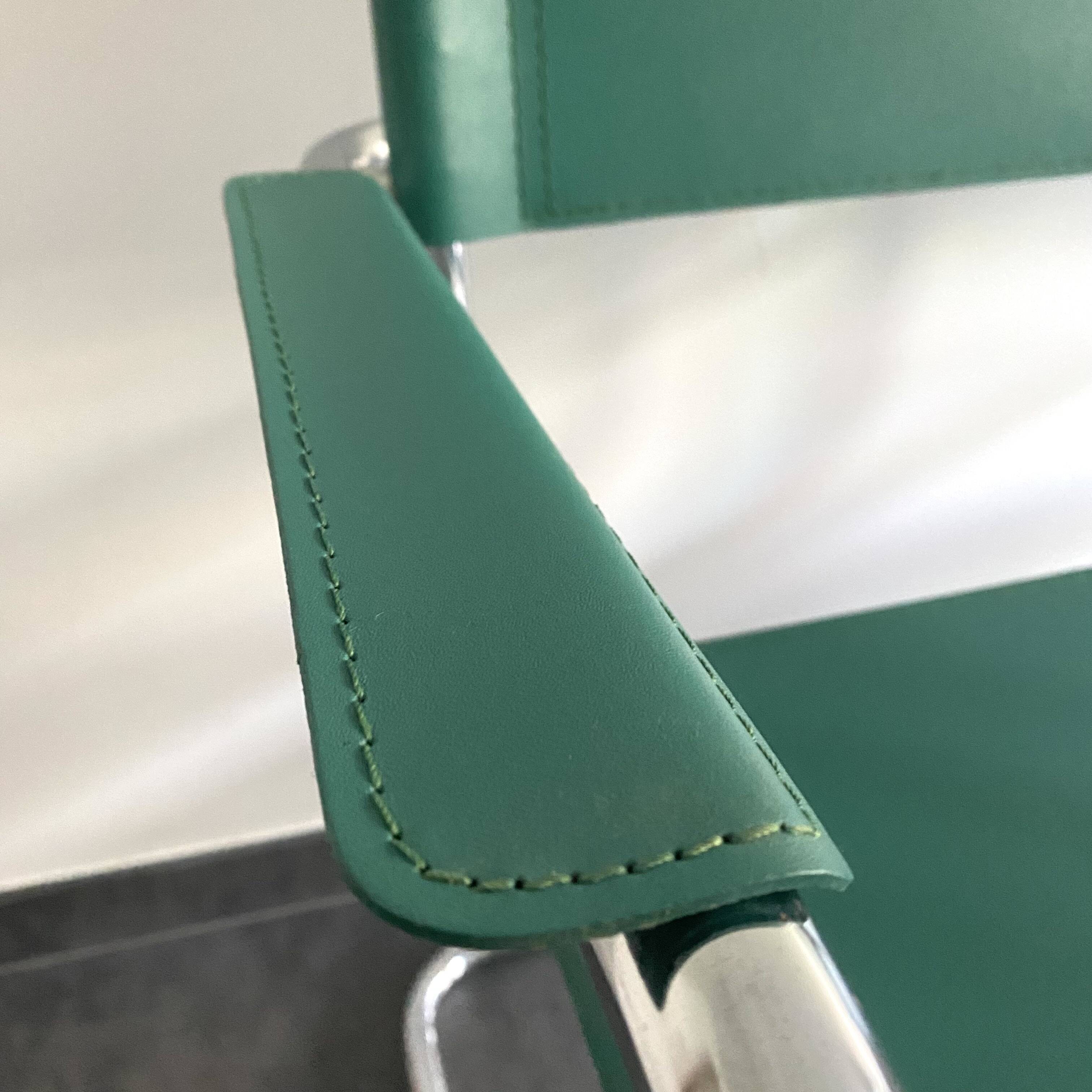 Pair of faux leather and chrome armchairs