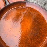 Orange glazed ceramic plates from the 1970s
