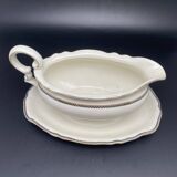 Porcelain sauce boat with black and gold checkered border