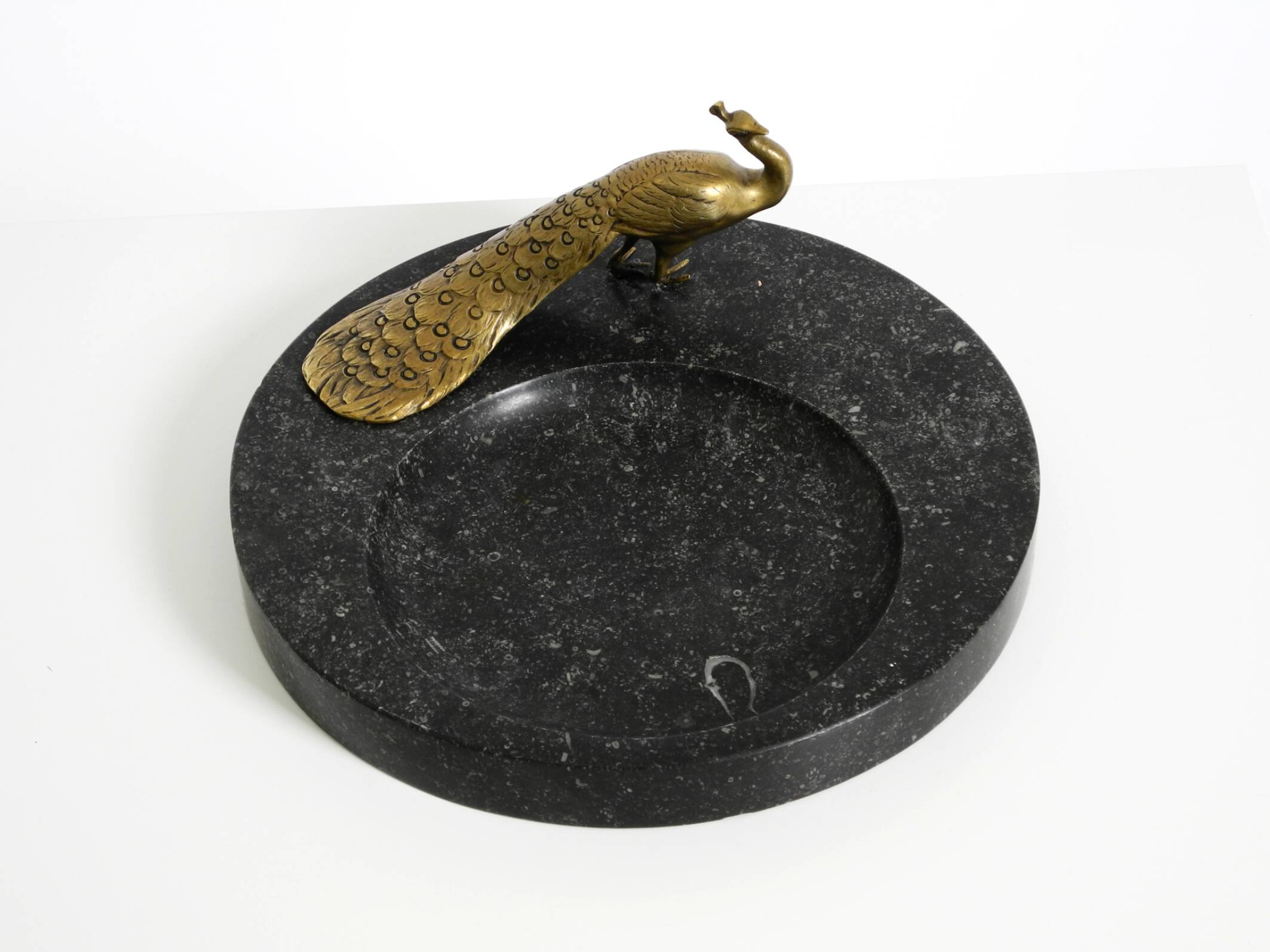 Beautiful, large black granite valet tray featuring a brass peacock, circa