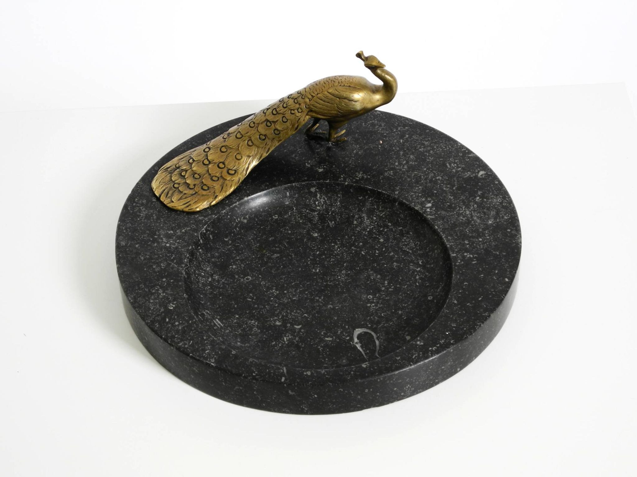 Beautiful, large black granite valet tray featuring a brass peacock, circa