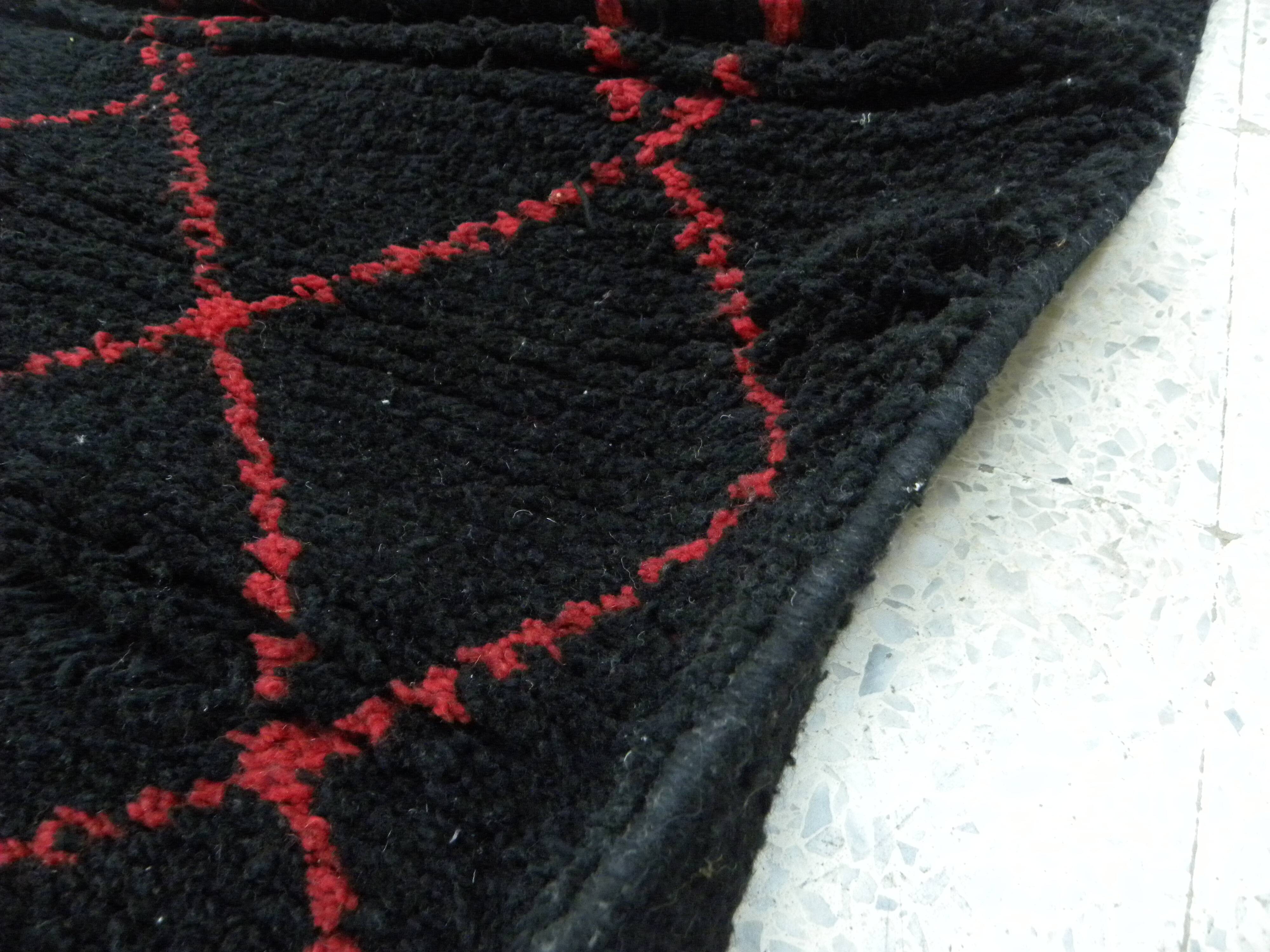 Vintage ancestral black Berber rug in wool
