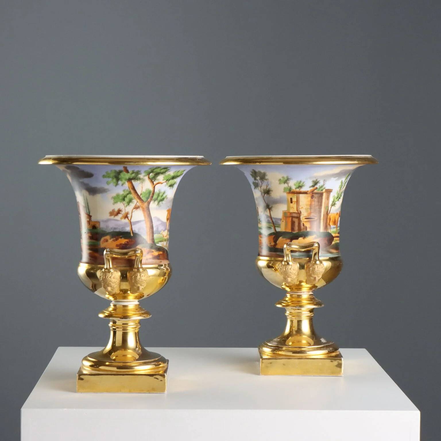 Pair of antique painted and decorated porcelain vases, France, 19th century.